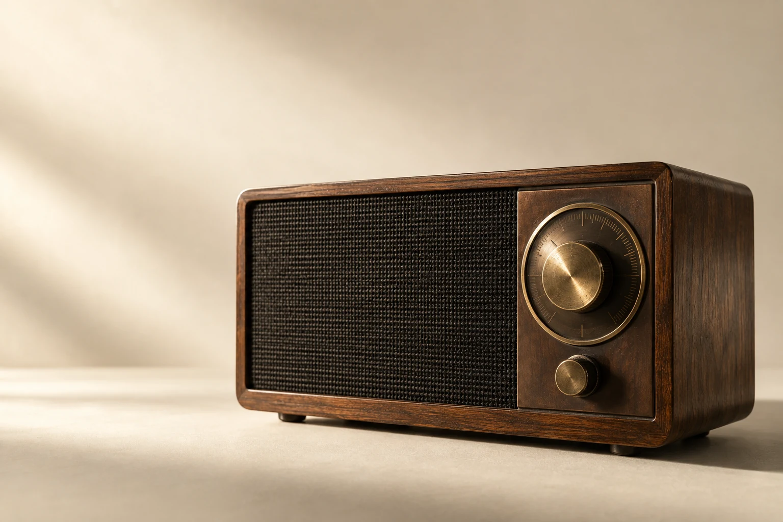 A walnut AM radio on a warm, sunlit surface